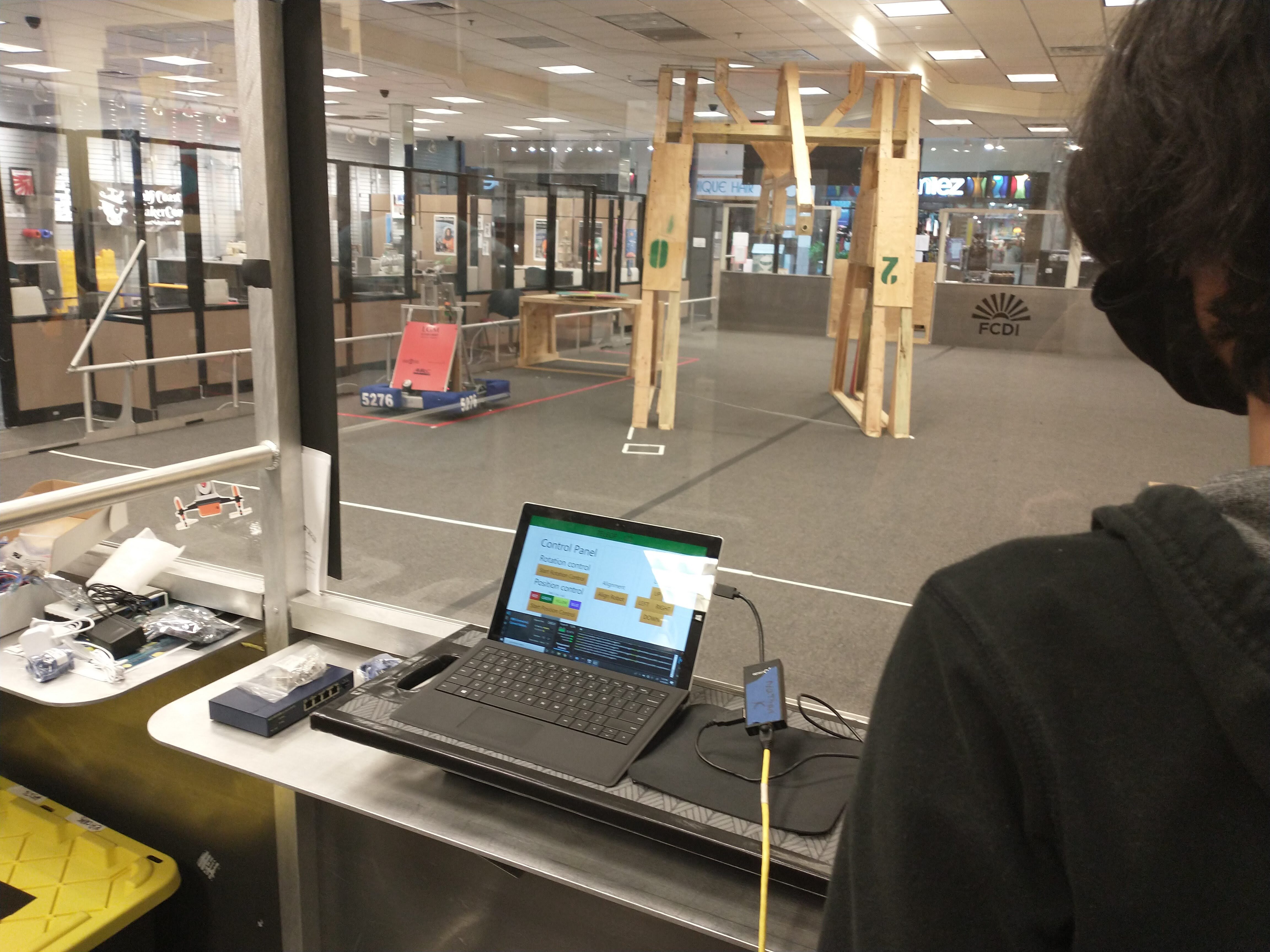 Students looking at field and FRC driverstation